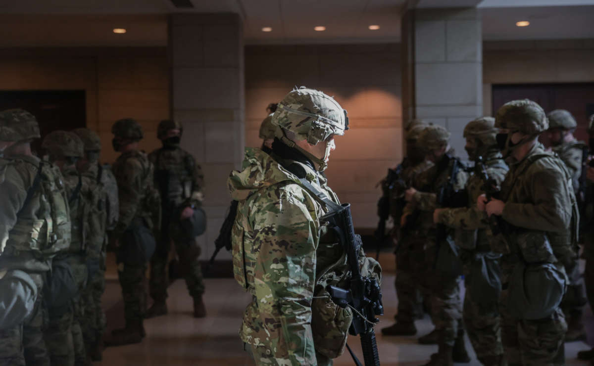 Members of the National Guard leave the U.S. Capitol Visitor Center after a security threat during a dress rehearsal ahead of the 59th Inaugural Ceremonies on the West Front at the U.S. Capitol on January 18, 2021, in Washington, D.C.