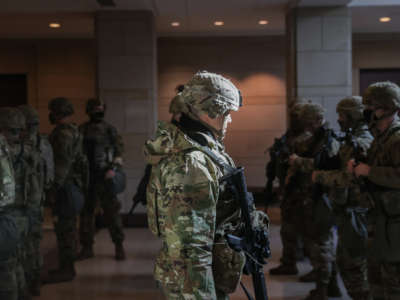 Members of the National Guard leave the U.S. Capitol Visitor Center after a security threat during a dress rehearsal ahead of the 59th Inaugural Ceremonies on the West Front at the U.S. Capitol on January 18, 2021, in Washington, D.C.