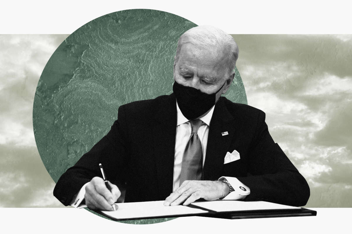 President Joe Biden signs an executive order with globe and sky behind