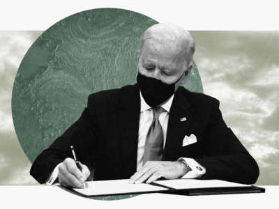 President Joe Biden signs an executive order with globe and sky behind