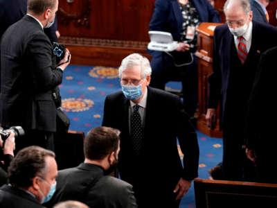 Then-Senate Majority Leader Mitch McConnell leaves the House chamber at the U.S. Capitol in Washington, D.C., January 6, 2021.