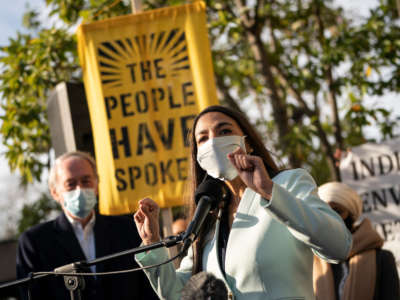 Rep. Alexandria Ocasio-Cortez speaks outside of the Democratic National Committee headquarters on November 19, 2020, in Washington, D.C.