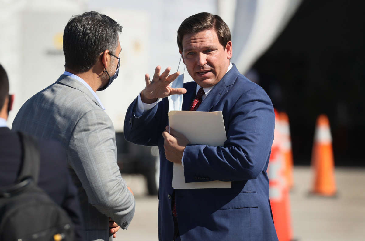 Florida Gov. Ron DeSantis leaves after holding a press conference about the opening of a COVID-19 vaccination site at the Hard Rock Stadium on January 6, 2021, in Miami Gardens, Florida.