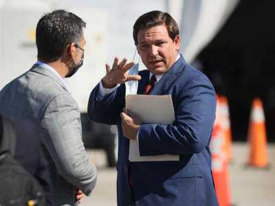 Florida Gov. Ron DeSantis leaves after holding a press conference about the opening of a COVID-19 vaccination site at the Hard Rock Stadium on January 6, 2021, in Miami Gardens, Florida.