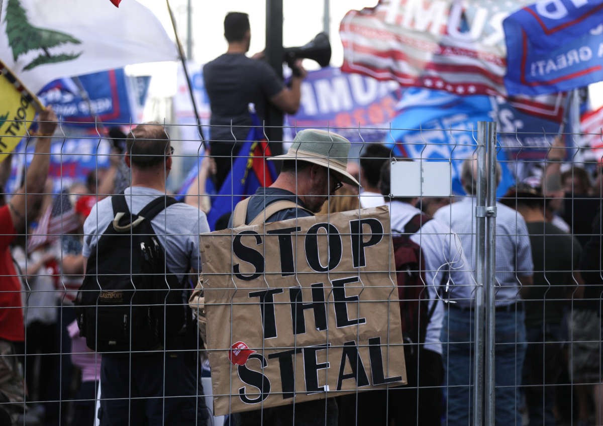 Trump supporters demonstrate at a "Stop the Steal" rally in front of the Maricopa County Elections Department office on November 7, 2020, in Phoenix, Arizona.