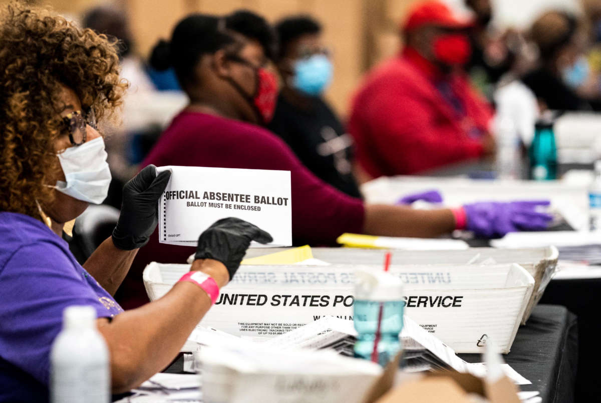 Absentee ballots and overseas ballots are received and processed at the Elections Preparation Center at State Farm Arena in Atlanta, Georgia, on November 3, 2020.