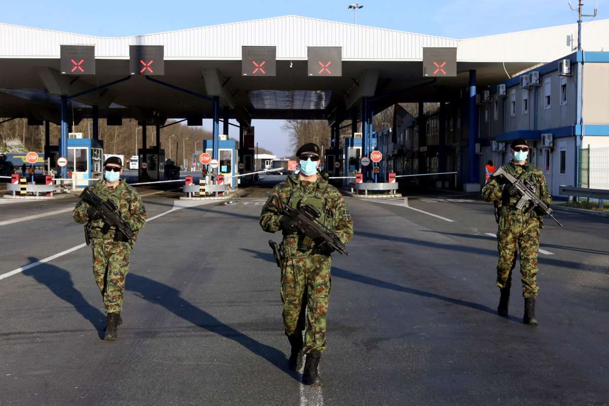Serbian soldiers patrol along the Batrovci border crossing between Serbia and Croatia on March 20, 2020.