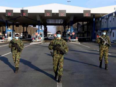 Serbian soldiers patrol along the Batrovci border crossing between Serbia and Croatia on March 20, 2020.