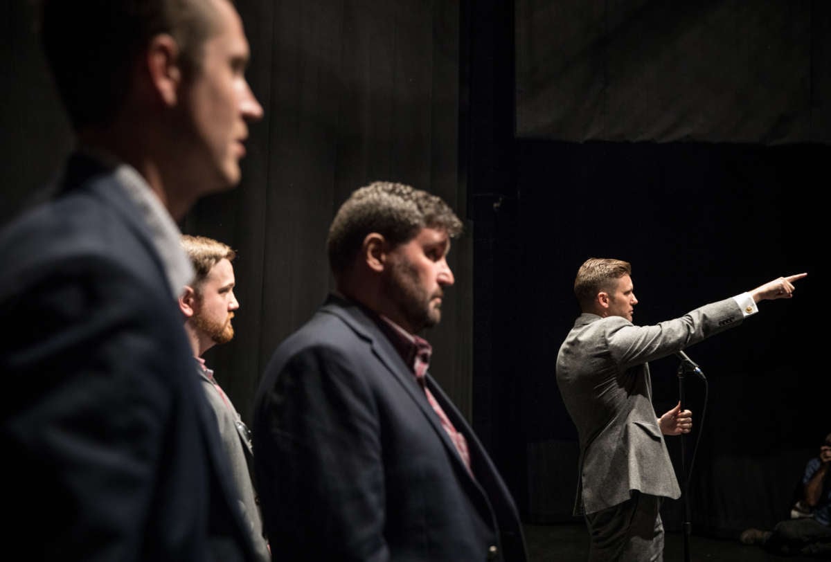 Richard Spencer points at someone in a manner that's visually evocative of a nazi salute