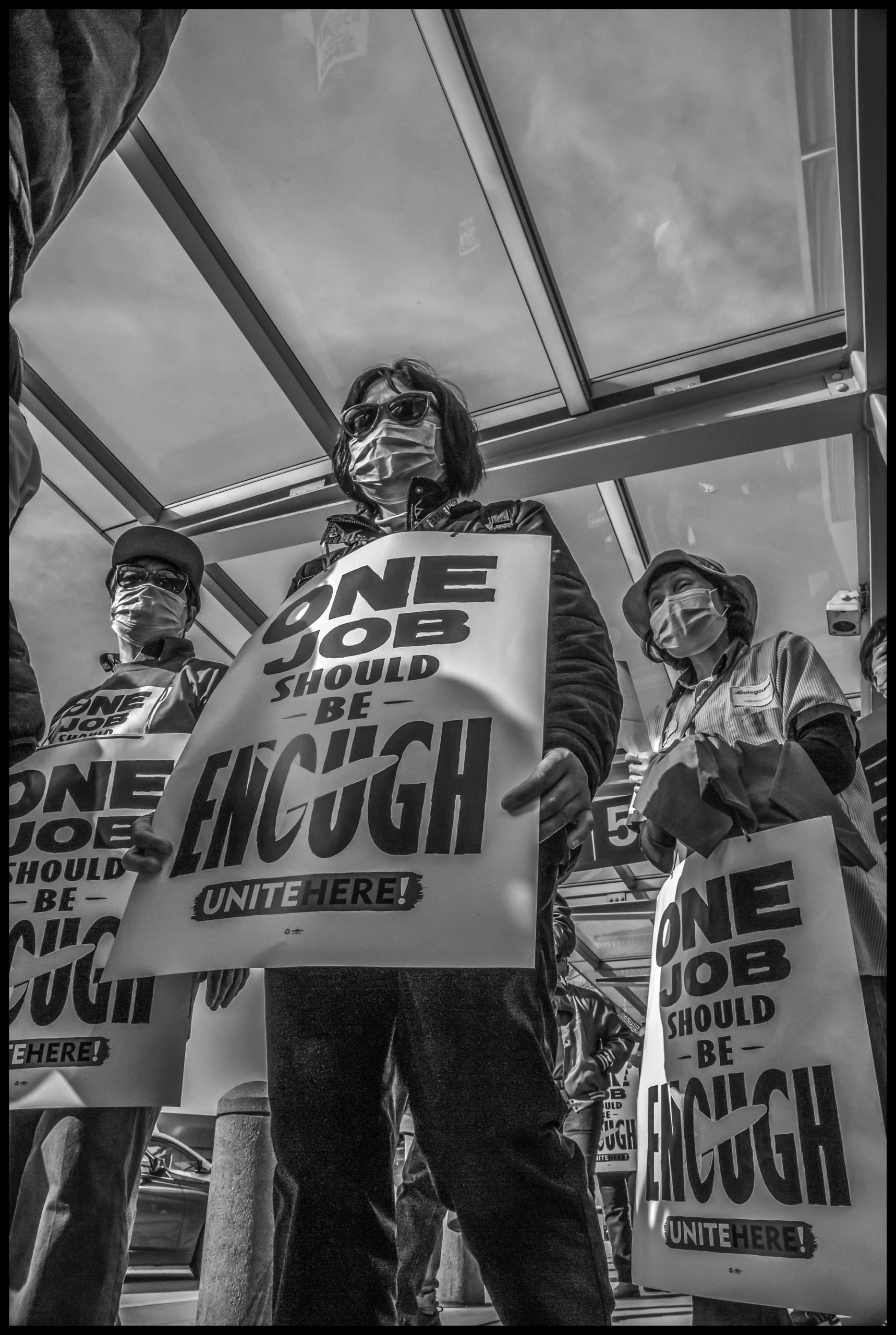 Airline kitchen workers, members of Unitehere Local 2, picket at the American Airlines terminal at San Francisco International Airport.