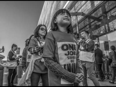 Airline kitchen workers bring their children to the picket line.