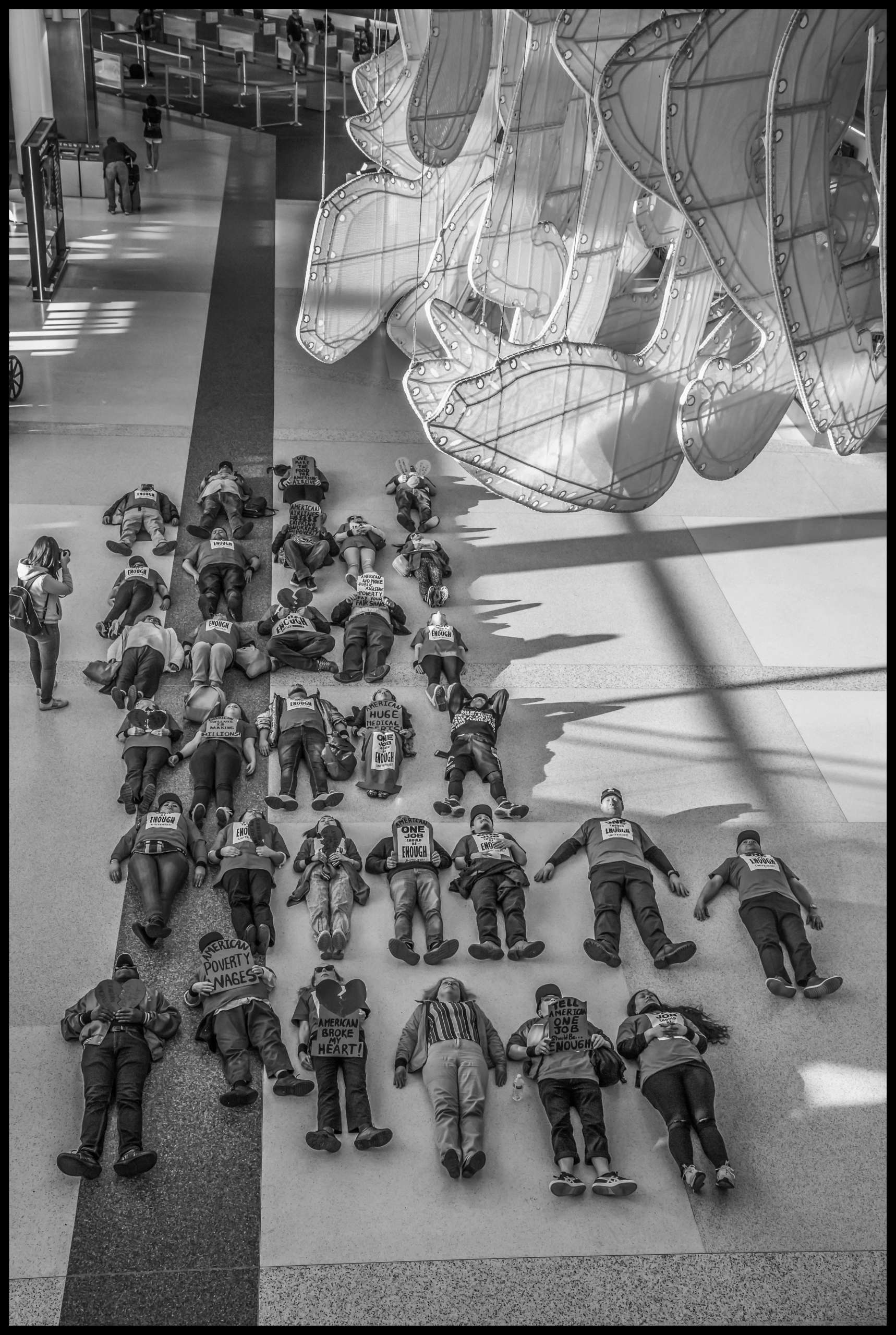 Airline kitchen workers conduct a die-in at the American Airlines terminal at SFO.