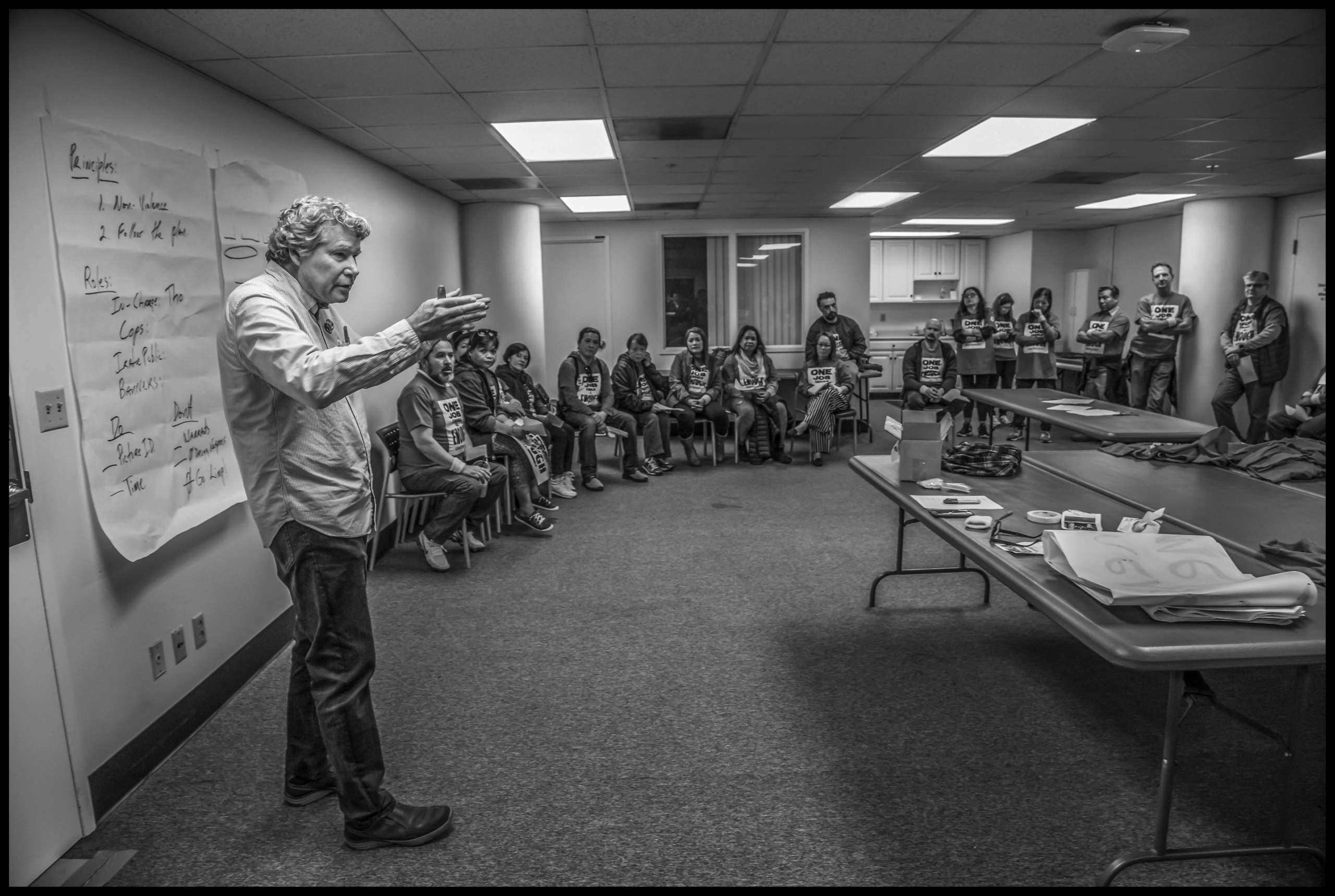 Kevin O'Conner, regional organizer for Local 2, goes over the plan for civil disobedience with workers and supporters.