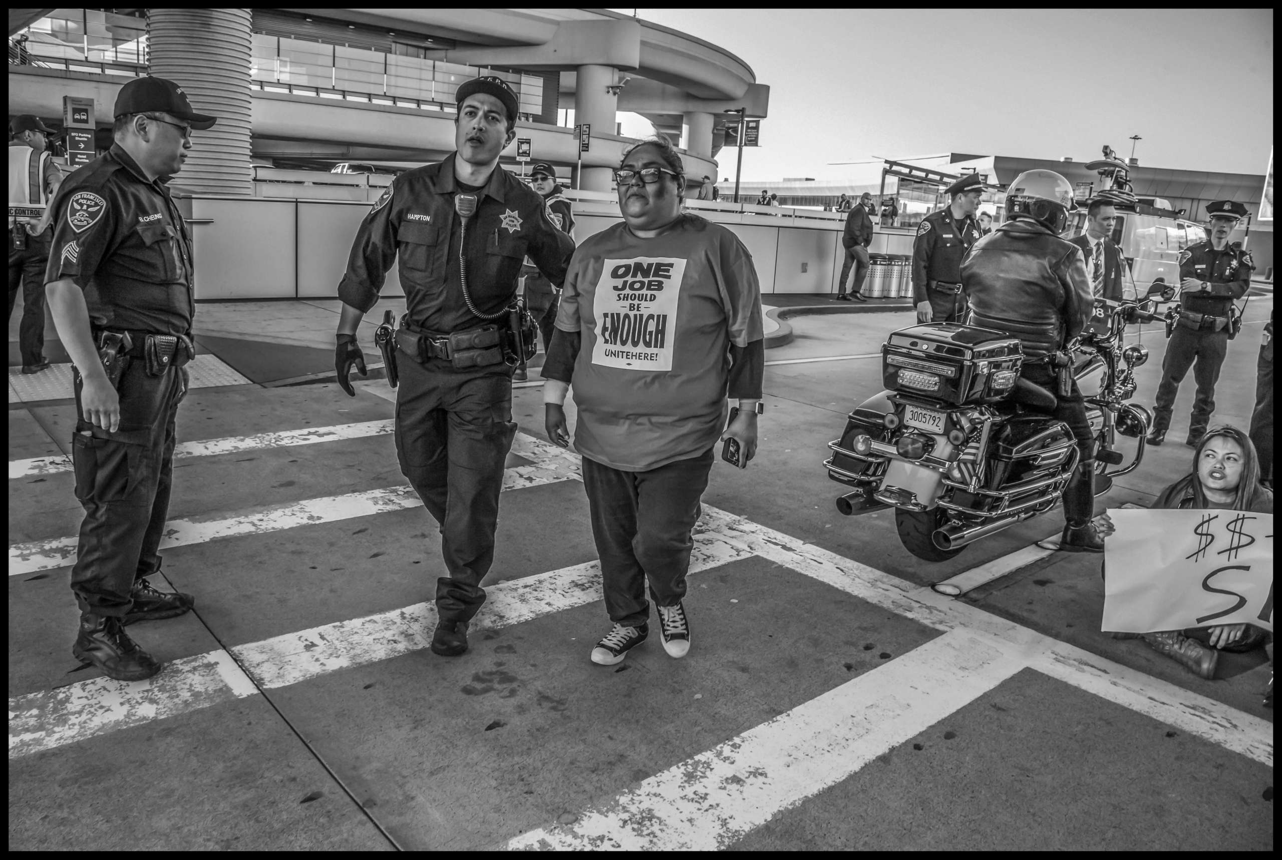 Olga Miranda, president of San Francisco's janitors' union, SEIU Local 87, is arrested for sitting in the roadway.