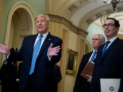 President Trump makes remarks to the media in the Capitol, standing with Treasury Secretary Steven Mnuchin and Vice President Mike Pence, after attending the Senate Republican Policy luncheon on March 10, 2020.