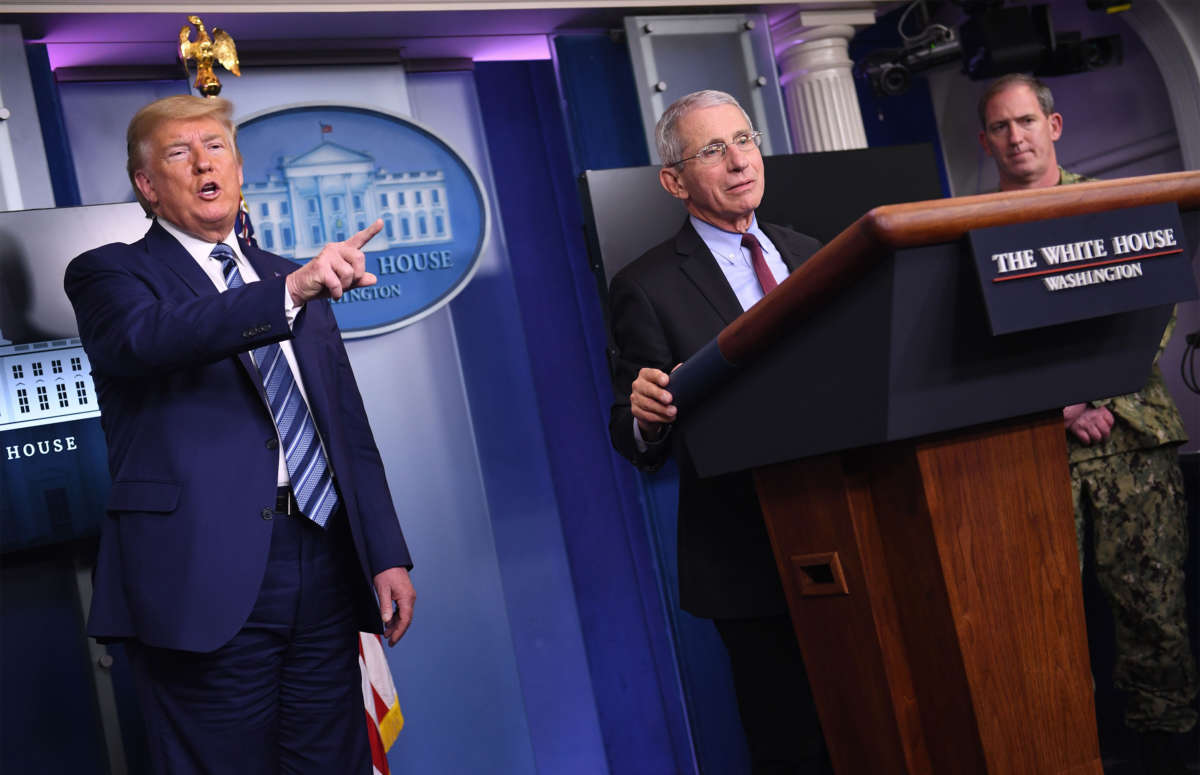 Director of the National Institute of Allergy and Infectious Diseases Anthony Fauci stands at the podium as President Trump dismisses a question during an unscheduled briefing after a Coronavirus Task Force meeting at the White House on April 5, 2020, in Washington, D.C.