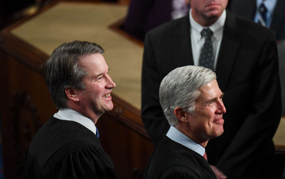 Justice Brett Kavanaugh, left, and Justice Neil M. Gorsuch attend the State of the Union address in the House chamber of the U.S. Capitol, February 5, 2019, in Washington, D.C.