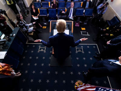 President Trump speaks with members of the coronavirus task force during a briefing in response to the COVID-19 coronavirus pandemic in the James S. Brady Press Briefing Room at the White House on April 3, 2020, in Washington, D.C.