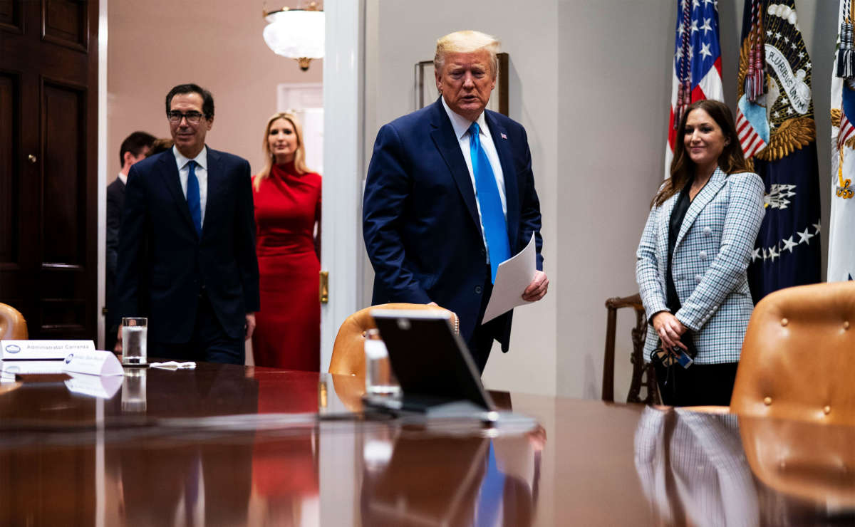 President Trump, Treasury Secretary Steven Mnuchin and the president's daughter Ivanka Trump arrive for a video conference with representatives of large banks and credit card companies in the Roosevelt Room at the White House on April 7, 2020, in Washington, D.C.
