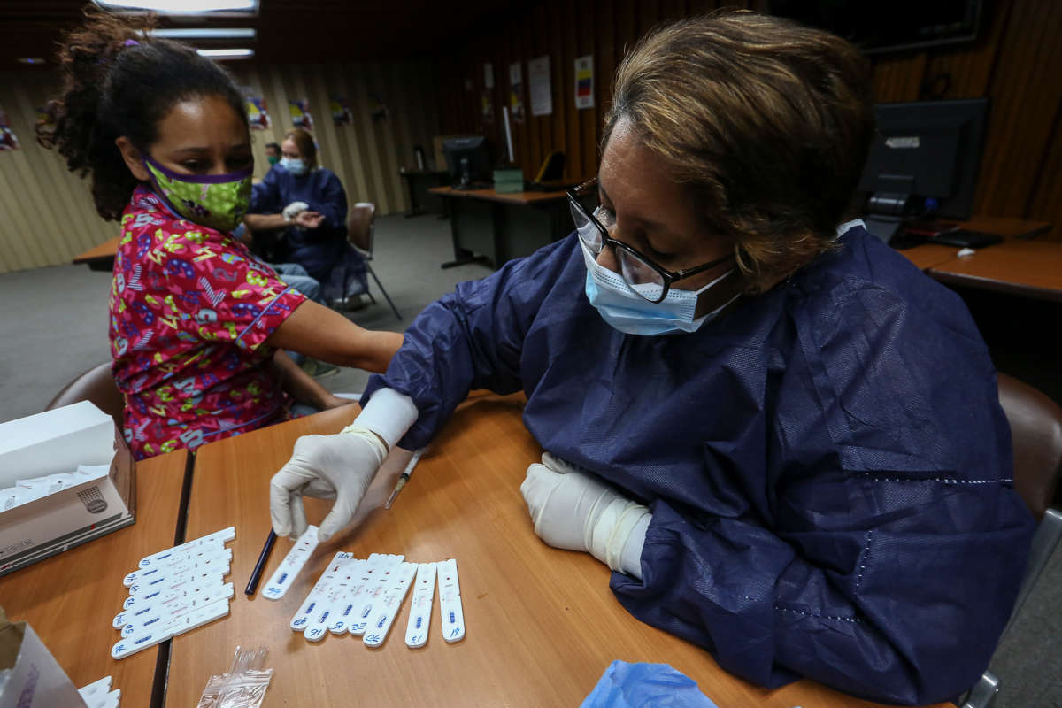 Doctors from the Cuban Medical Mission carry out rapid tests for the coronavirus (COVID-19) on employees of the metro in Caracas, Venezuela. Trump’s intensification of sanctions against Venezuela and Iran during a pandemic constitutes a crime against humanity.