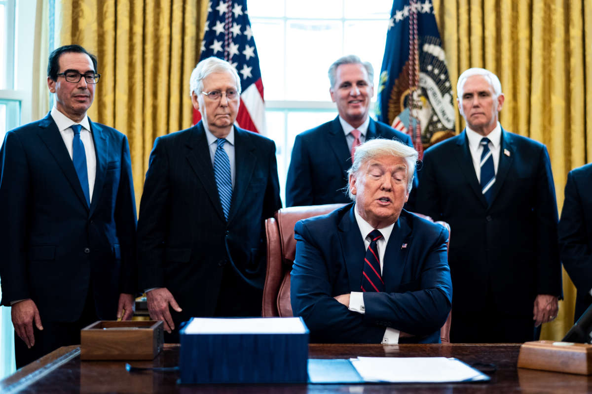 Donald Trump crosses his arms while surrounded by other Donald Trump crosses his armsevill white men