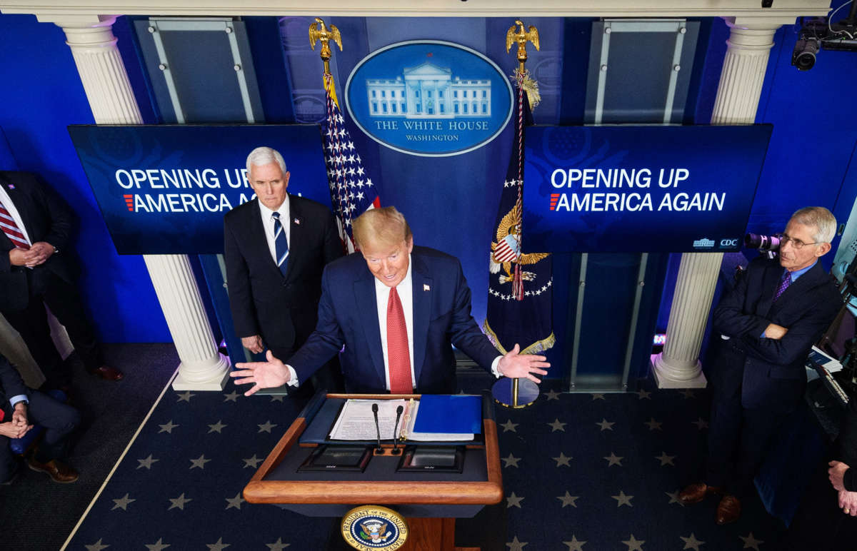 President Trump, flanked by Vice President Pence and Director of the National Institute of Allergy and Infectious Diseases Anthony Fauci, speaks during the daily briefing on the novel coronavirus in the Brady Briefing Room of the White House on April 16, 2020, in Washington, D.C.