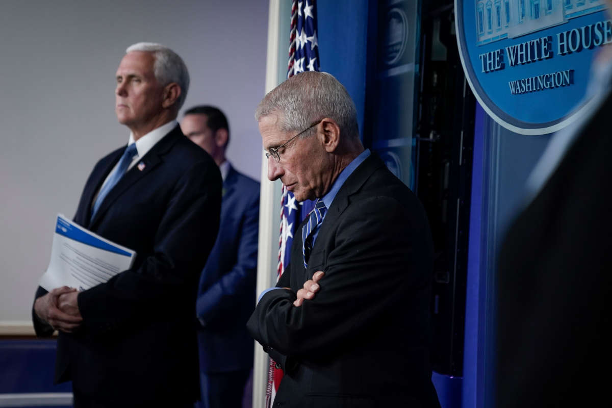 Vice President Mike Pence and Dr. Anthony Fauci, director of the National Institute of Allergy and Infectious Diseases, attend a briefing on the coronavirus pandemic, in the press briefing room of the White House on March 24, 2020, in Washington, D.C.