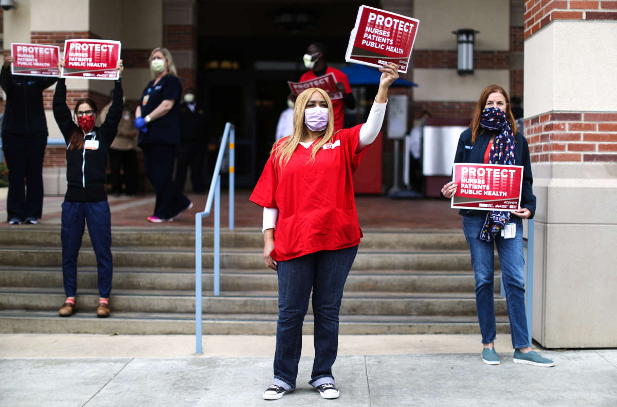 Registered nurses and healthcare workers protest what they say is a lack of personal protective equipment available for frontline workers at UCLA Medical Center amid the coronavirus pandemic on April 13, 2020, in Santa Monica, California.