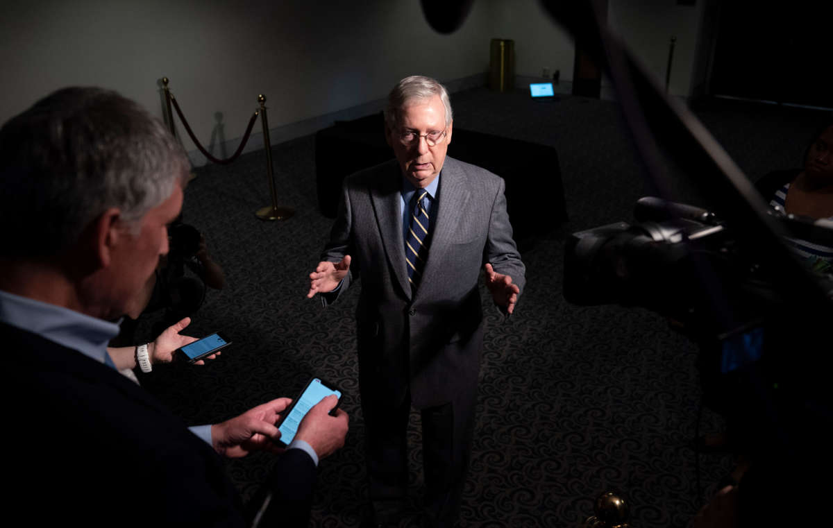 Senate Majority Leader Mitch McConnell speaks to reporters after exiting a meeting in the Hart Senate Office Building on Capitol Hill, March 20, 2020, in Washington, D.C.