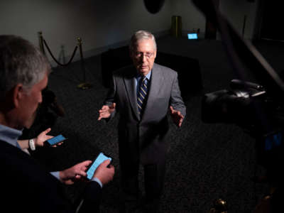 Senate Majority Leader Mitch McConnell speaks to reporters after exiting a meeting in the Hart Senate Office Building on Capitol Hill, March 20, 2020, in Washington, D.C.