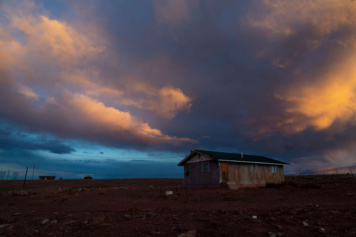 Storm clouds pass over one of many rural homes on the Navajo reservation which do not have electricity or running water during the coronavirus pandemic on March 27, 2020, in Cameron, Arizona.