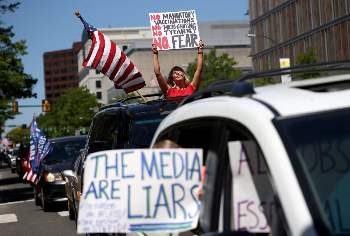 Protesters against restrictions intended to limit the spread of COVID-19 attempt to shut down traffic near the Virginia State Capitol on April 22, 2020, in Richmond, Virginia.