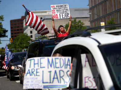 Protesters against restrictions intended to limit the spread of COVID-19 attempt to shut down traffic near the Virginia State Capitol on April 22, 2020, in Richmond, Virginia.