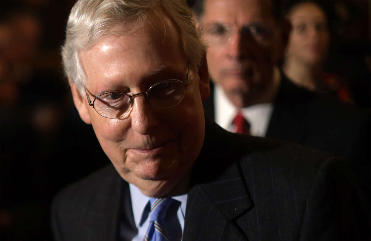 Senate Majority Leader Mitch McConnell listens during a news briefing at the U.S. Capitol on February 25, 2020, in Washington, D.C.