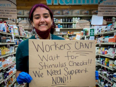 A worker at the Sprouts Farmers Market in McAllen, Texas, protests for hazard pay and coronavirus-safe working conditions.