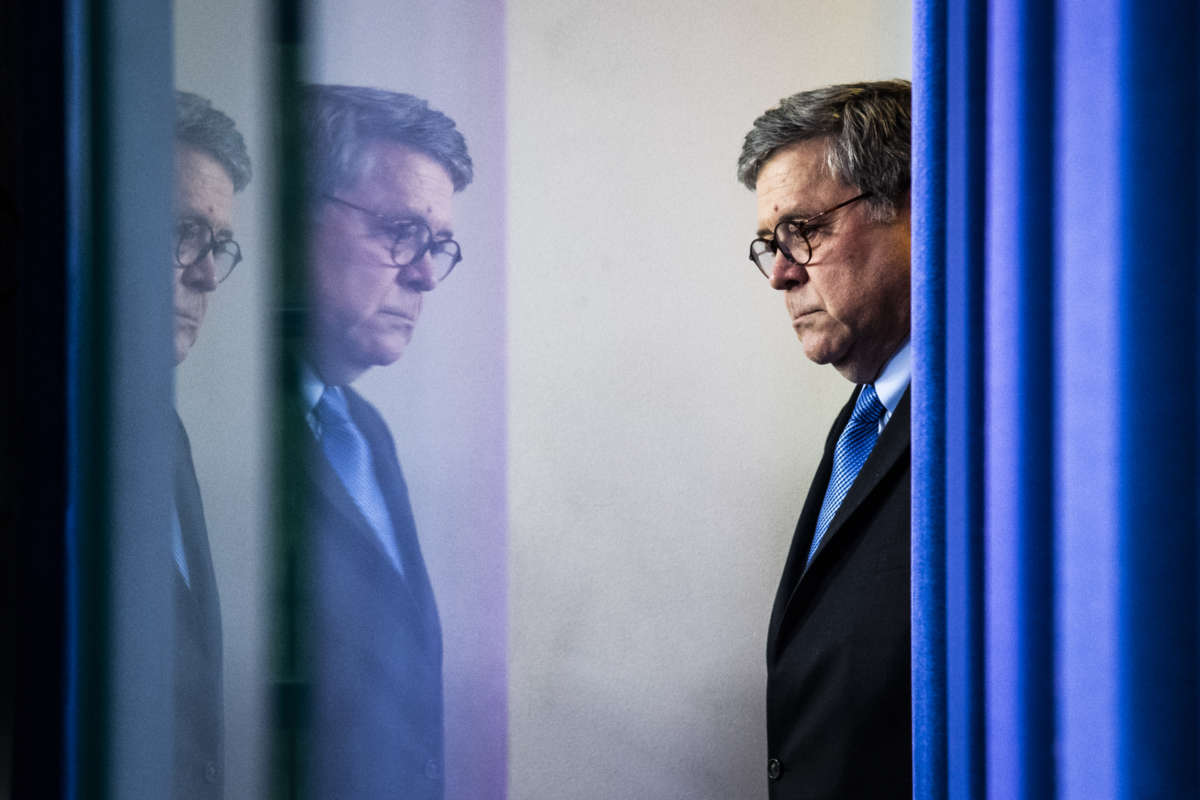 Attorney General William Barr arrives with President Donald Trump to speak with members of the coronavirus task force during a briefing in response to the COVID-19 pandemic in the James S. Brady Press Briefing Room at the White House on Wednesday, April 1, 2020, in Washington, D.C.