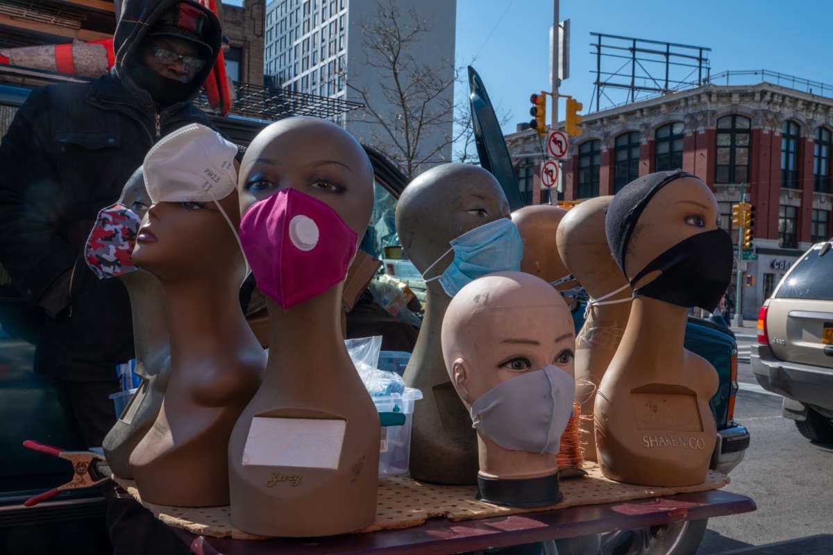 A street vendor sells face masks and coverings outside of the 125th Street MTA station on April 16, 2020, in New York City.