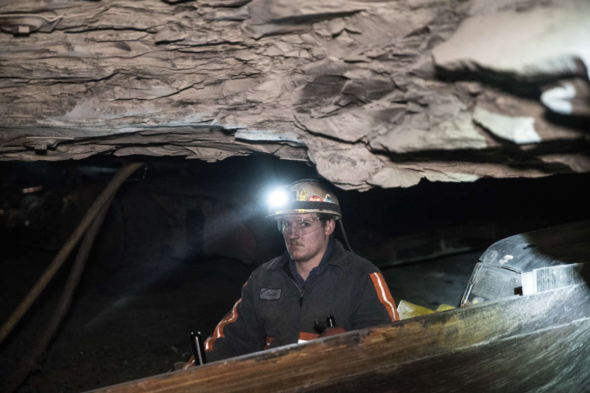 A Wellmore coal miner in Buchanan County, VA, works deep underground in April 2016.