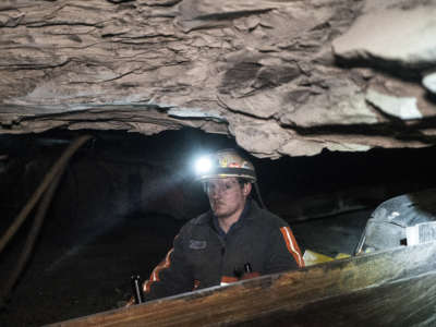 A Wellmore coal miner in Buchanan County, VA, works deep underground in April 2016.