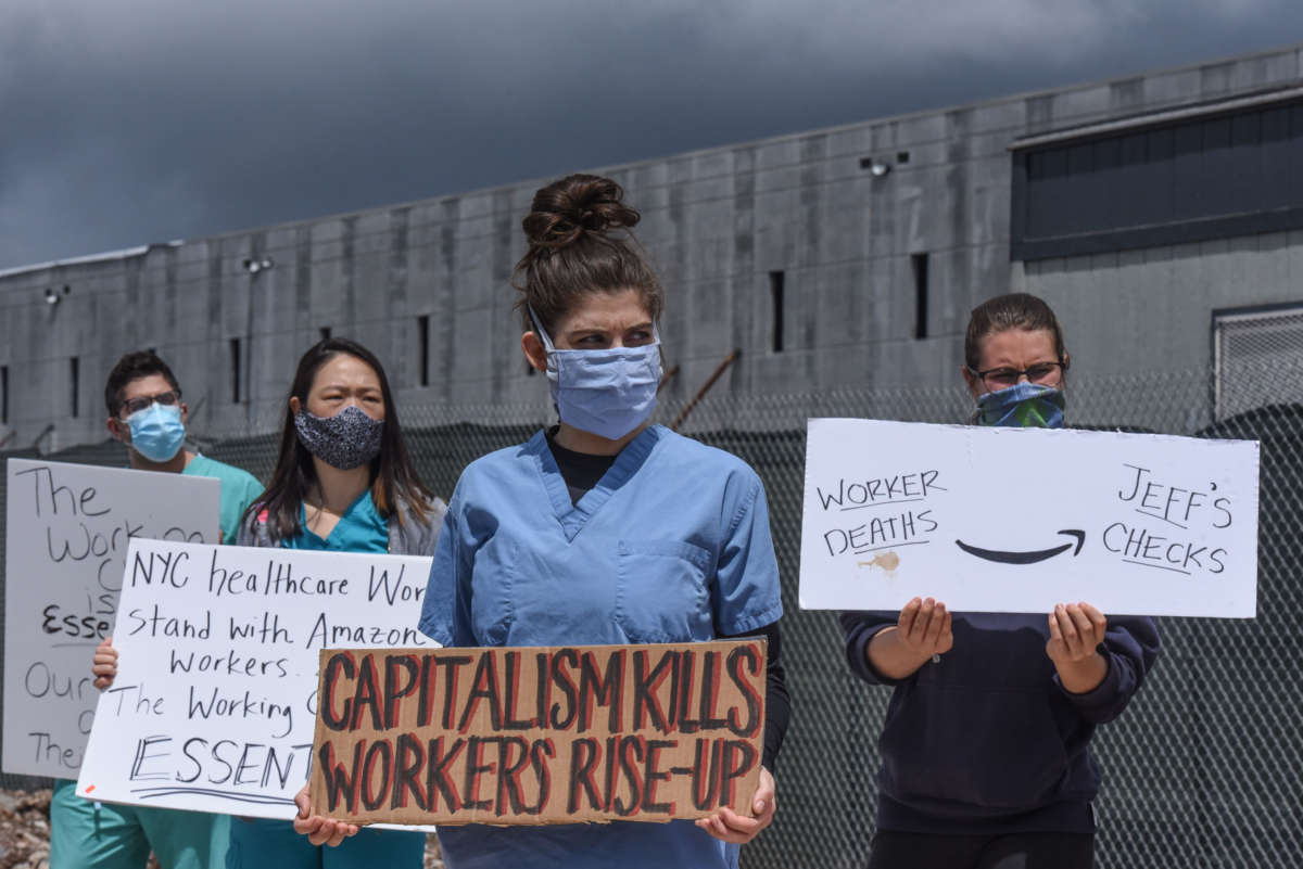 People protest working conditions outside of an Amazon warehouse fulfillment center on May 1, 2020, in the Staten Island borough of New York City.