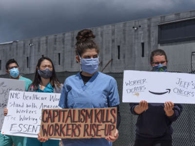 People protest working conditions outside of an Amazon warehouse fulfillment center on May 1, 2020, in the Staten Island borough of New York City.