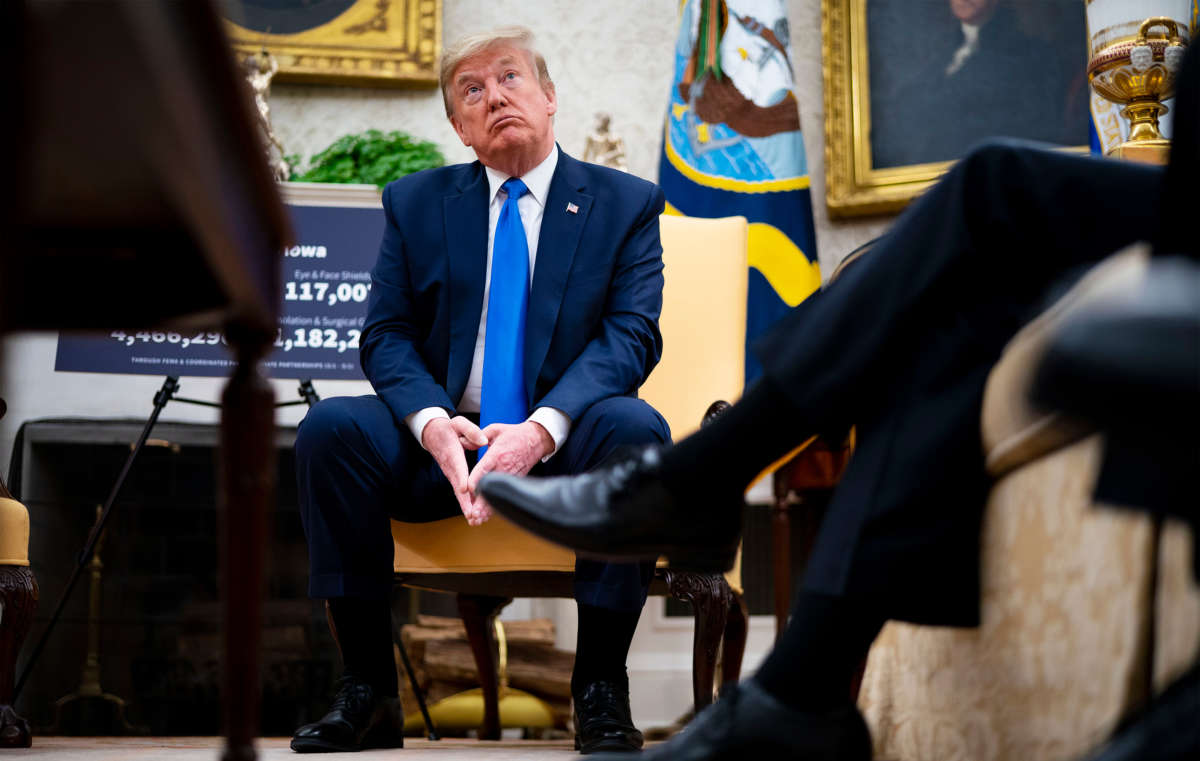 President Trump talks to reporters while meeting with Iowa Governor Kim Reynolds in the Oval Office at the White House as he continues to promote re-opening business during the coronavirus pandemic, May 6, 2020, in Washington, D.C.