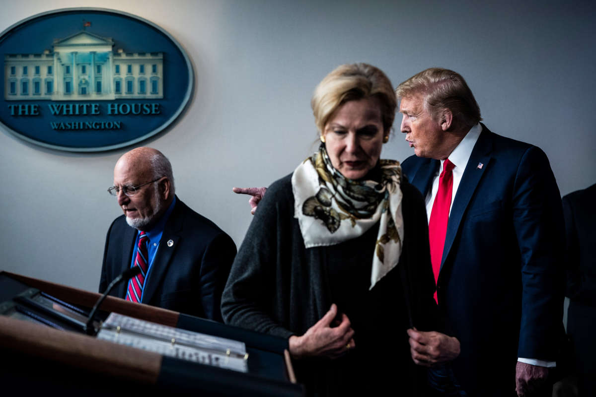 President Trump speaks with Dr. Deborah Birx, White House coronavirus response coordinator, Dr. Robert Redfield, director of the Centers for Disease Control and Prevention, and members of the coronavirus task force during a briefing in the James S. Brady Press Briefing Room at the White House on April 22, 2020, in Washington, D.C.