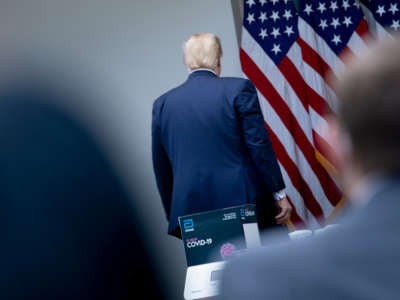 Donald Trump walks away from a briefing