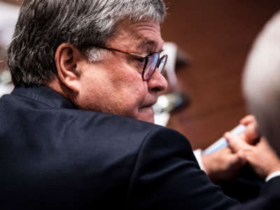 Attorney General William Barr listens during a cabinet meeting in the Cabinet Room at the White House on July 16, 2019, in Washington, D.C.