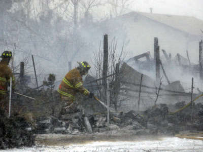 Brighton Fire department crews control a fire in Brighton, Colorodo. A barn was destroyed when a controlled burn by a neighbor got out of hand.