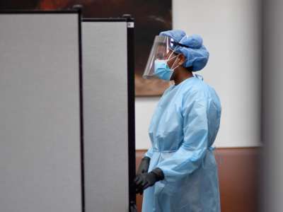 A registered nurse waits to test residents for COVID-19 antibodies at Abyssinian Baptist Church in the Harlem neighborhood of New York City on May 14, 2020.