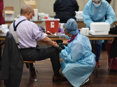 A registered nurse draws blood to test for COVID-19 antibodies at Abyssinian Baptist Church in the Harlem neighborhood of New York City on May 14, 2020.