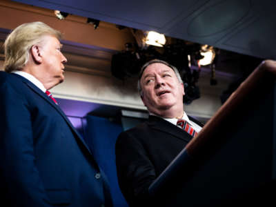 President Trump speaks with Secretary of State Mike Pompeo and the coronavirus task force during a briefing in the James S. Brady Press Briefing Room at the White House on March 20, 2020, in Washington, D.C.