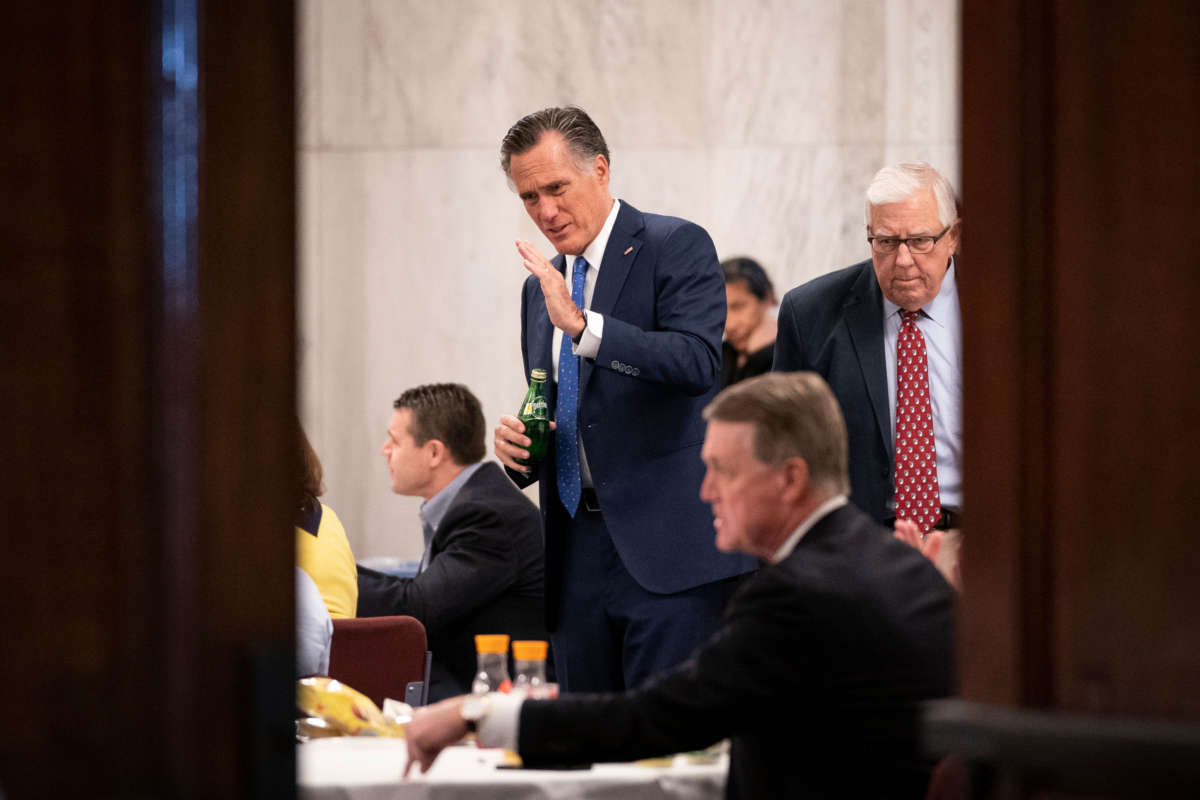 Sen. Mitt Romney speaks as he attends a Senate GOP lunch meeting in the Russell Senate Office Building on Capitol Hill, March 20, 2020, in Washington, D.C.